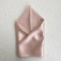 Pure silk square scarf in elegant pink color, beautifully folded for detailed texture showcase. - Pink