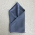 High-end mulberry silk square scarf in elegant grey blue, showcasing smooth texture detail. - Blue