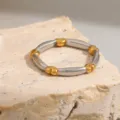 Stainless steel two-tone ring featuring gold heart nodes silver band variant view - Size 7 / Heart Patchwork Style (R1020) / Silver and Gold