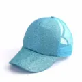 Detail view of a light blue glitter trucker hat, showing sparkly front panel and mesh back. - One Size / Lake Blue