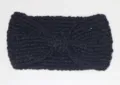 Detailed close-up of the black knitted winter headband, warm fleece knit with cute bow design. - Black