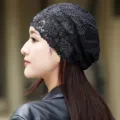Detailed side view of a black lace slouchy beanie for women, breathable summer headwear. - Adult / Black