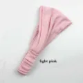 Detail view of the solid color pleated yoga headband in light pink, soft and stretchy fabric. - Light Pink