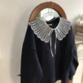 Detailed view showing dark blue sweatshirt with exquisite white embroidered lace detachable collar. - Korea Style