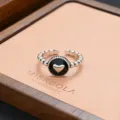Detailed shot of vintage silver adjustable ring with black heart centerpiece and beaded band. - Black Round Heart Pattern Style (JZ0161)