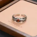 Detailed shot of retro gothic style open metal ring with red stone on display box. - Thai Silver Old Red Stone Punk Style (JZ0241)