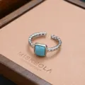 Vintage silver open ring with square synthetic turquoise stone, stylish hip-hop jewelry piece. - Hip-Hop Carved Turquoise Style (JZ0279)