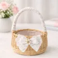 Close-up view of a woven flower basket detail featuring lace handle and pearl bow decor. - Diameter 15cm / Luxury Pearl Large Bow (Small)
