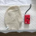 Cozy cream knit balaclava winter warm earflap hood hat for women stylish daily wear. - 24x31cm / Ivory