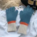 Detailed view of color-blocked knitted gloves featuring blue, orange, and white cozy design. - 11x25cm / Blue