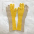 Close up details of women colorblocked knit gloves, cozy wool material for winter warmth. - 29x10cm / Yellow