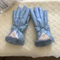 Detail view of light blue windproof winter gloves with plush grey cuffs and embroidered accent. - G005 / Blue