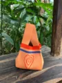 Detailed shot of orange knit tote bag featuring red heart pattern and colorful stripes. - Regular Fit / Orange