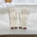 Knitted winter touch screen gloves in off-white with striped cuffs and fine texture detail. - Touch Screen Knitted Gloves / Ivory