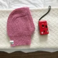 Pink knitted balaclava hat detail, cozy winter thermal headwear with cute label design. - 24x31cm / Pink