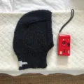 Black knitted balaclava winter warm earflap beanie hat detail view fashion cozy casual accessory - 24x31cm / Black