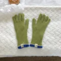Detailed shot of green knit gloves with blue cuffs and woven labels on white fluffy background. - Touch Screen Knitted Gloves / Yellow-Green