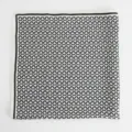 Detailed close-up view of a classic black and white chain pattern silk square scarf. - 70x70cm / White