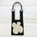 Schwarze Stricktasche mit cremefarbenem Blumenmuster und schicken Lederriemen Damen. - Einzelner Gurt Modell / Schwarz