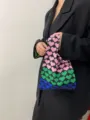 Close-up detail of the stylish knitted tote bag featuring a vibrant gradient heart pattern. - Basic Knit Bag Style / Pink, Green, and Blue
