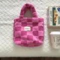 Detailed close-up view of the pink plush checkered handbag, soft fuzzy winter tote bag texture. - 27x26x11cm / Rose Red