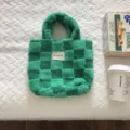 Green checkered plush handbag detail shot, showcasing the soft fluffy texture and trendy design. - 27x26x11cm / Green