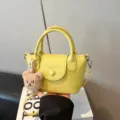 Yellow PU leather handbag with cute bear pendant, trendy shoulder cross body bag for women. - With Pendant / Yellow