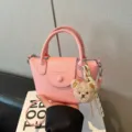Pink mini handbag with cute teddy bear pendant, stylish PU leather crossbody bag. - With Pendant / Pink