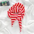 Red and white striped knitted triangular scarf for women, cozy winter neck warmer and stylish neckerchief. - Red