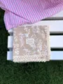 Detailed view of cotton linen square scarf with floral pattern, elegant lace trim and label. - 58x58cm / Light Yellow