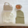 Winter knitwear detail view showing cozy cardigan, stylish balaclava hood and trendy bag. - Bean Green