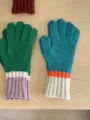 Detailed view of women's autumn winter colorblock knit five-finger gloves warm cozy accessory. - Green