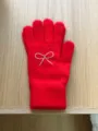 Red knit gloves for women featuring a sparkling rhinestone bow and heart detail for winter warmth. - 20x10cm / Red