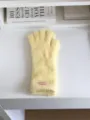 Close-up detail of fluffy yellow winter gloves, soft warm plush knit for cold weather wear. - 27X10CM-W207MD / Yellow