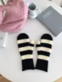 Winter warm knitted striped mittens for men and women, cozy classic black and white style. - 26x10cm / Black