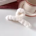 White fluffy hair claw clip for women, large winter plush shark clip for styling buns and ponytails. - Pure White
