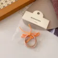 Einfaches dünnes Schleifen Haargummi 2er Set, süße orange und nude Pferdeschwanz Schlaufen. - 2 Stück/Packung / Orange