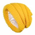 Detailed view of yellow knit slouchy beanie with smooth satin lining for hair protection. - Yellow