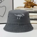 Dark grey washed bucket hat featuring white dinosaur skeleton embroidery for outdoor daily wear. - One Size / Gray