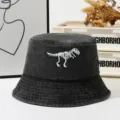 Washed denim bucket hat with white dinosaur skeleton embroidery, outdoor sun hat for men and women. - One Size / Black