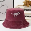 Vintage washed burgundy bucket hat featuring a cool white dinosaur skeleton embroidery for outdoor wear. - One Size / Burgundy