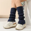 Cozy dark blue cable knit leg warmers for women, stylish winter boot cuffs and slouchy socks. - Navy Blue