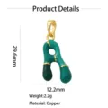 Gold-plated copper letter pendant detail showing green enamel finish, 29.6mm height. - Letter A