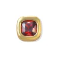 Close-up of a square gold brass bead featuring a faceted red zircon birthstone charm detail. - January (Red Zirconia)