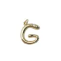 Detailed shot of the gold plated brass snake letter G pendant, exquisite metal texture. - Letter G / Gold