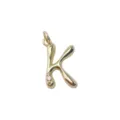 Detail shot of gold letter K pendant necklace accessory with sparkling crystal accent stone. - Letter K / Gold