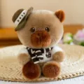 Cute brown plush teddy bear toy with hat and scarf, perfect soft desktop companion doll. - Capybara
