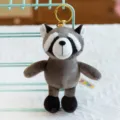 Cute plush raccoon keychain, cartoon animal bag pendant, soft stuffed toy with metal keyring. - Raccoon