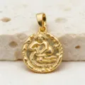 Detailed shot of the retro gold zodiac coin pendant featuring an intricate embossed design. - Aquarius