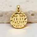 Detailed close-up of a vintage gold coin pendant featuring a twin relief design, gold-plated. - Gemini